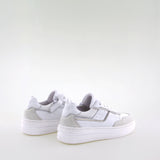 Girl's white leather sneakers by Giga Shoes.