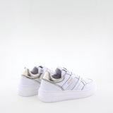 Girl's white leather sneakers by Giga Shoes.