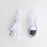 Girl's white leather sneakers by Giga Shoes.