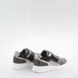 Girl's black suede sneakers by Giga Shoes.