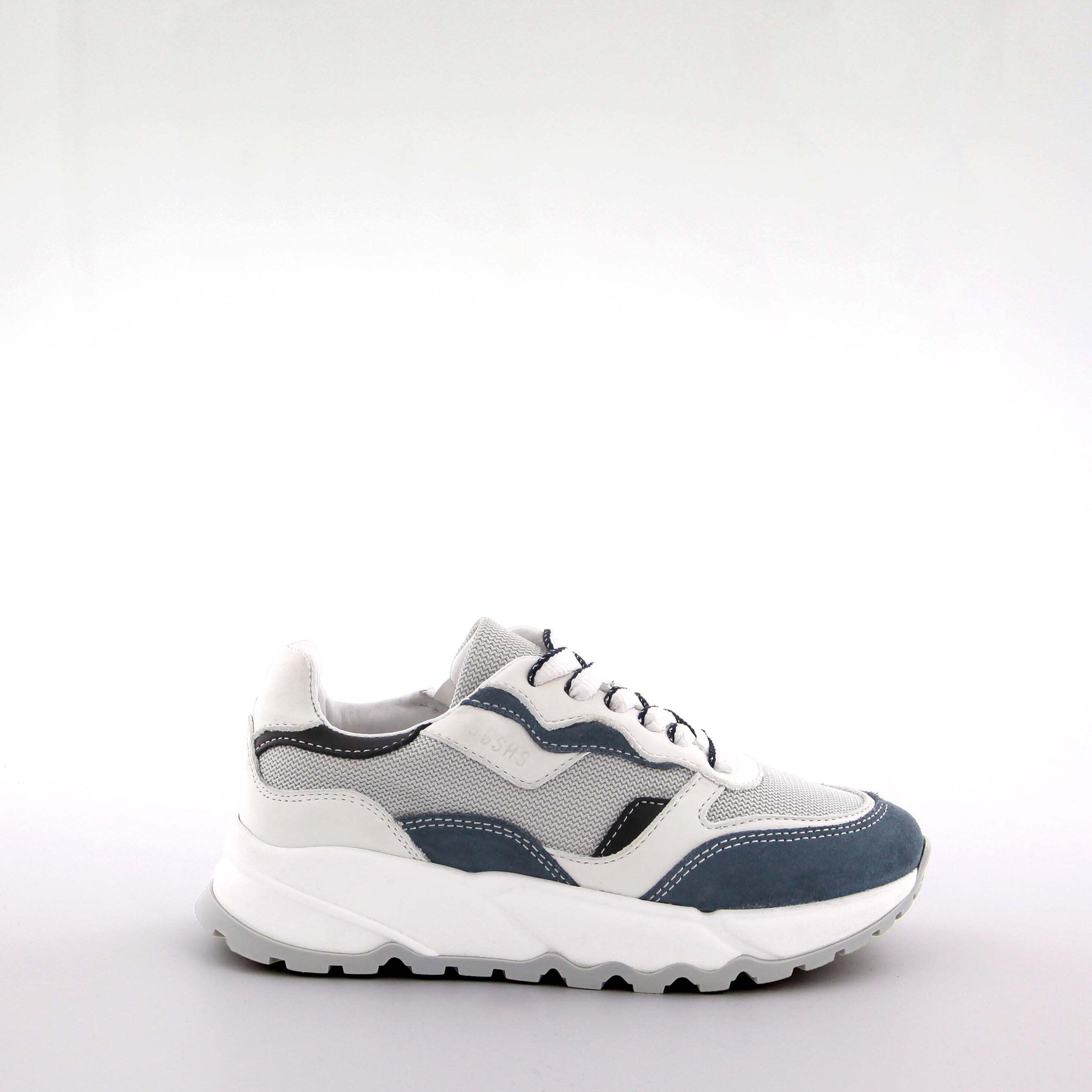 Side view of GIGAshoes Ruben White sneakers, featuring premium white leather, grey accents, and a durable rubber sole on a clean white background.